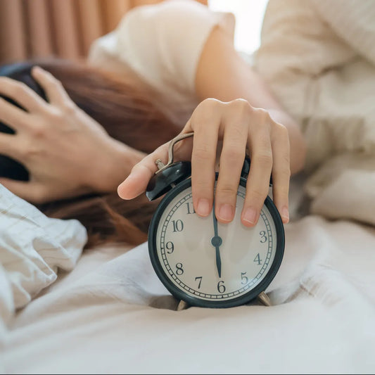 Image of woman struggling with insomnia, which can be fixed using the SomniBand sleep headphones.