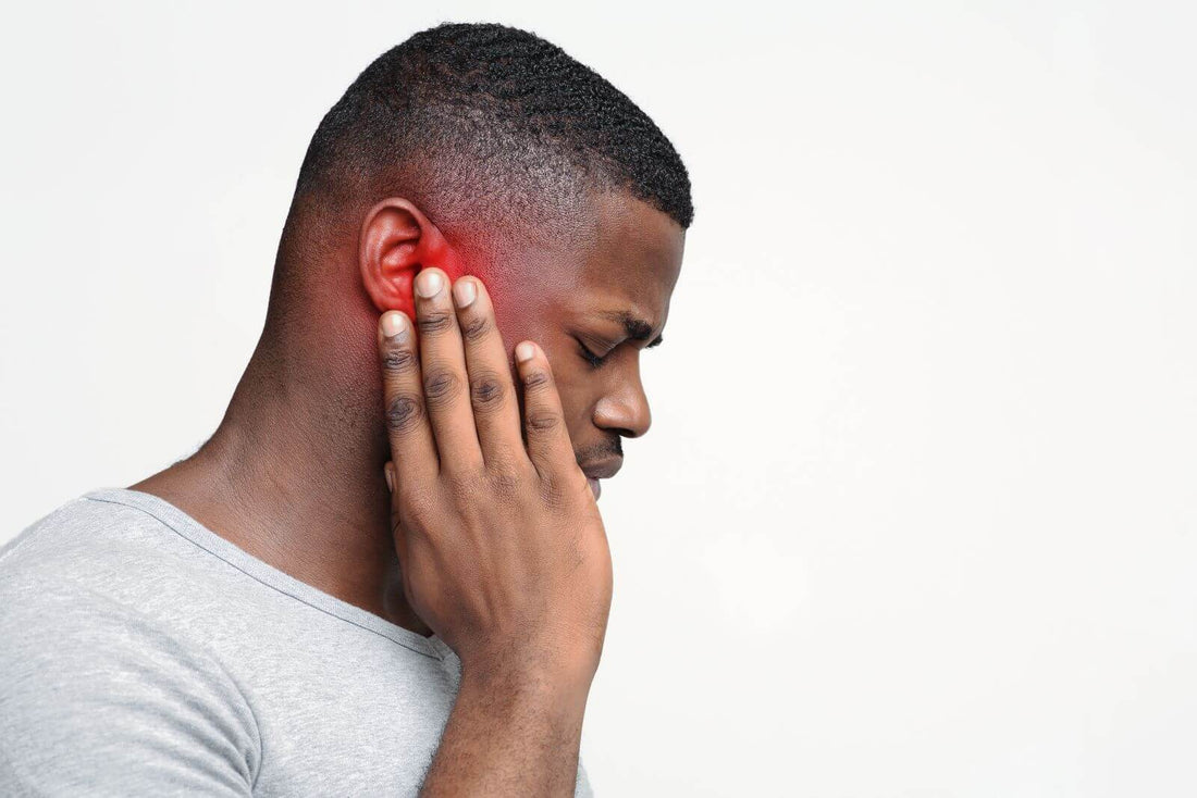 Image showing a man with tinnitus, which the SomniBand Sleep Headphones help treat, as well as insomnia and other sleep related problems.