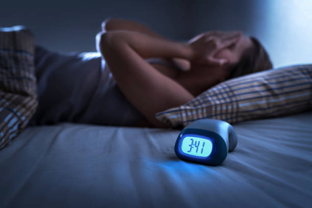 Image of a woman with Insomnia to show how Insomnia can be solved with the SomniBand sleep headphones