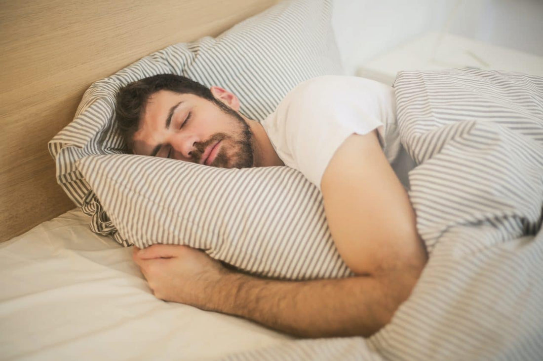 Picture of man sleeping with tinnitus, which was being helped by the SomniBand sleep headphones, that fix tinnitus