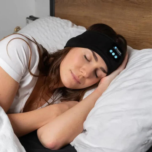 Image of woman sleeping with the Somniband sleep headphones that help with tinnitus, insomnia and sleeping faster.