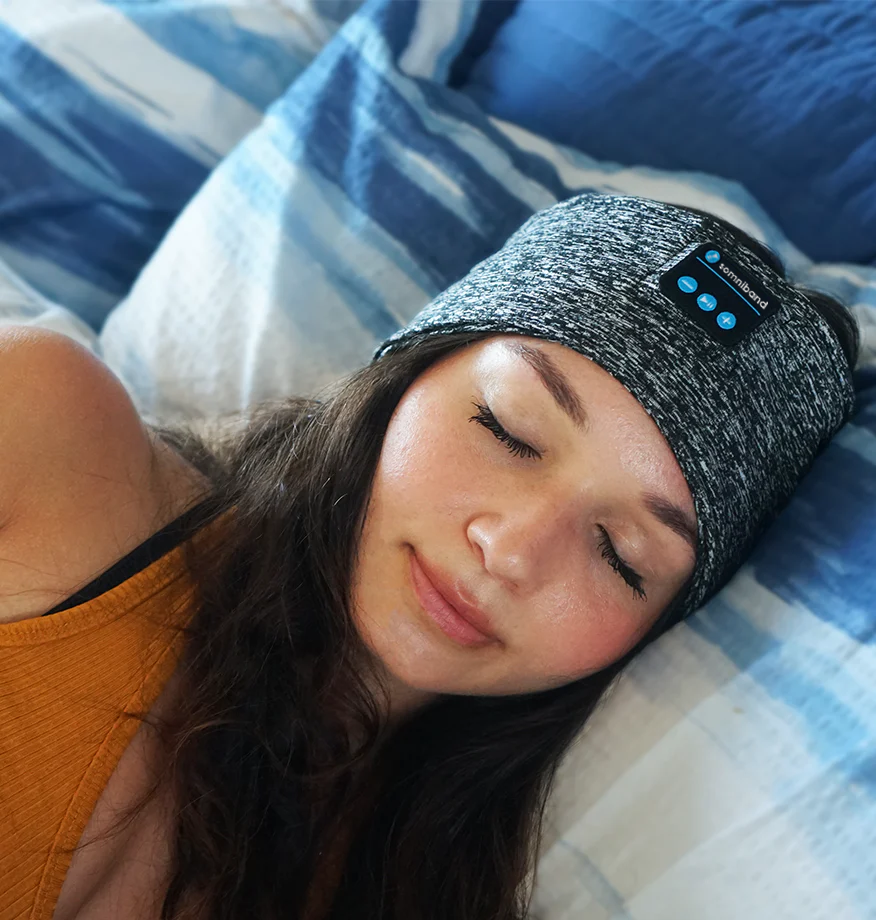 Picture of woman sleeping with the SomniBand Sleep Headphones used for helping tinnitus, insomnia and other sleep related problems.